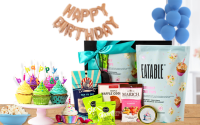 Birthday gift box with happy birthday banner and blue balloons